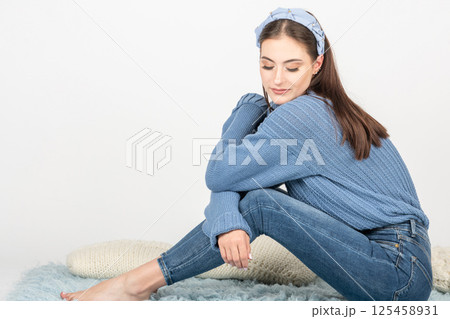 Happy beautiful woman with blue sweater portrait Happy beautiful woman with blue sweater portrait 125458931