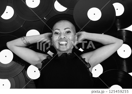 Thai beautiful woman lying on vinyl records Thai beautiful woman lying on vinyl records 125459255