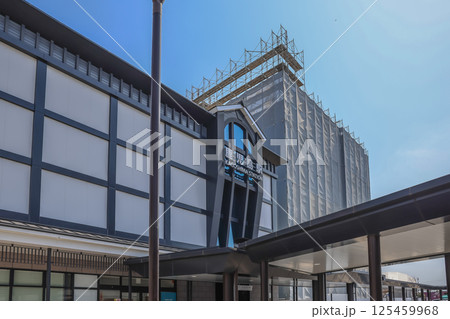 March 23 2025 Modern Train Station Entrance Under Clear Skies, Japan March 23 2025 Modern Train Station Entrance Under Clear Skies, Japan 125459968