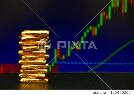 Photo a gold bars the candlestick chart background, Fluctuations in gold prices concept. 125460206