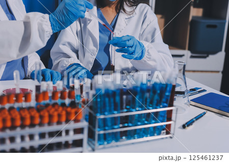 Researcher using a professional microscope 125461237