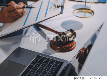 Concept of legal counseling. The lawyer or legal counsel is listening and providing advice to business people. Concept of legal counseling. The lawyer or legal counsel is listening and providing advice to business people. 125461259