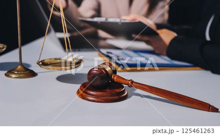 Concept of legal counseling. The lawyer or legal counsel is listening and providing advice to business people. Concept of legal counseling. The lawyer or legal counsel is listening and providing advice to business people. 125461263