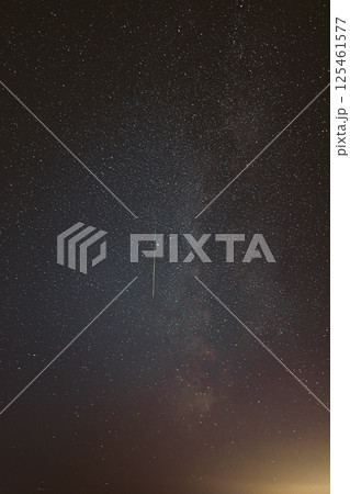 Real Night Sky Stars With Milky Way Galaxy. Natural Starry Sky Background with meteor trails lights. Background Night Starry Sky With Bright Stars And Meteoric Track Trail 125461577