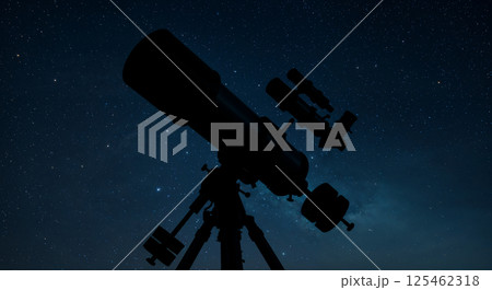 Silhouette of a telescope on a tripod against a starry night sky, with numerous stars visible. The scene evokes a sense of exploration and astronomy in a peaceful night setting 125462318