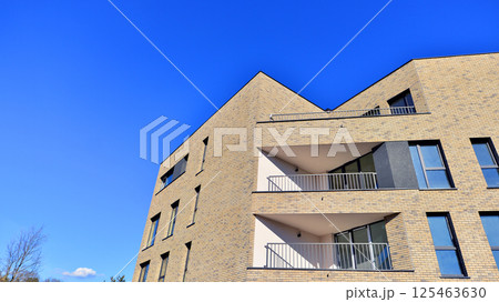 Modern architecture of urban residential apartment buildings on a sunny day. Facade of a modern apartment building. 125463630