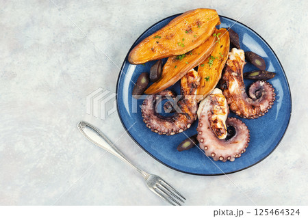 Grilled octopus with roasted potatoes. Grilled octopus with roasted potatoes. 125464324