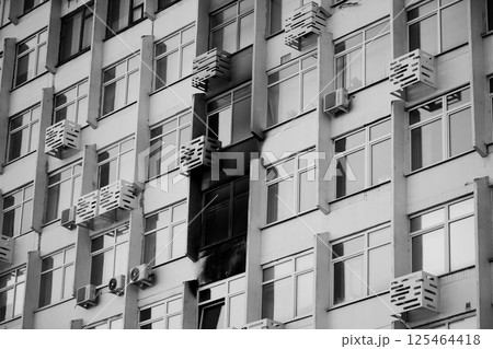 Consequences of a fire in a multi-storey building. Damaged multi-storey building, the aftermath of the explosion Consequences of a fire in a multi-storey building. Damaged multi-storey building, the aftermath of the explosion 125464418
