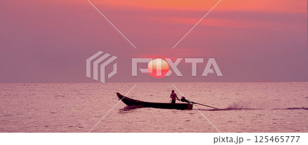 Traditional Thai Longtail boat on the background of a sea sunset and a huge orange sun. an incredible marine tropical landscape as a symbol of the love of travel and excursions, sea fishing panorama. Traditional Thai Longtail boat on the background of a sea sunset and a huge orange sun. an incredible marine tropical landscape as a symbol of the love of travel and excursions, sea fishing panorama. 125465777