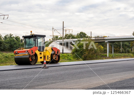 Road roller near bridge during infrastructure project Road roller near bridge during infrastructure project 125466367