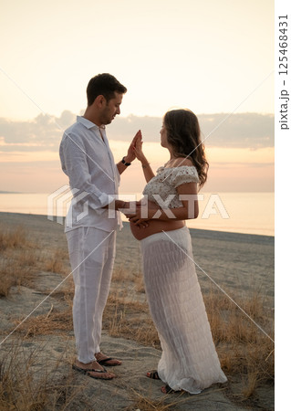 Hand In Hand On The Beach Loving Each Other  125468431