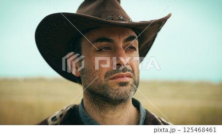 Cowboy with defiant look. 125468461
