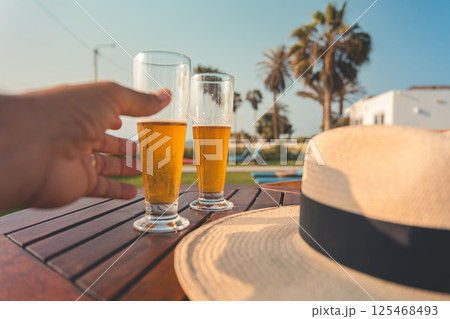 A person is holding a glass of beer, relax concept 125468493