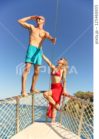 Couple enjoying sea adventure on yacht deck 125468935
