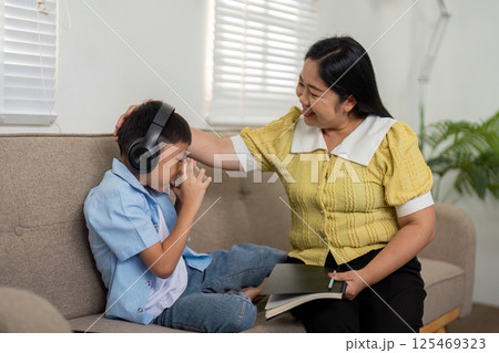 Back to School and Emotional Support. A mother comforting her son during school preparations. Back to School and Emotional Support. A mother comforting her son during school preparations. 125469323