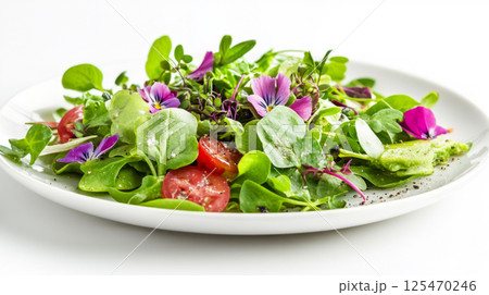 Artistic Salad with Fresh Greens and Purple Edible Flowers 125470246