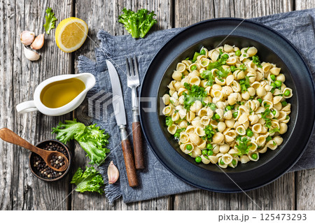 Pasta with green peas in a bowl, italian cuisine Pasta with green peas in a bowl, italian cuisine 125473293