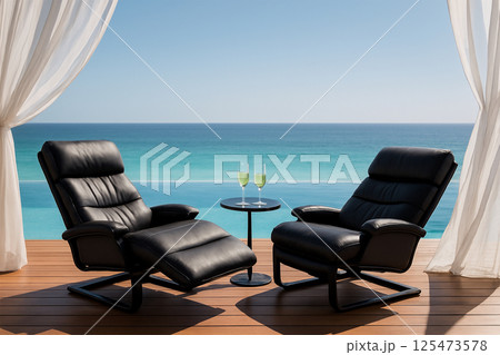 インフィニティプール付き高級デッキでくつろぐ黒のレザーチェアとシャンパン 125473578