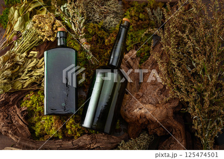 Vintage bottles with tinctures and various dried herbs. Vintage bottles with tinctures and various dried herbs. 125474501