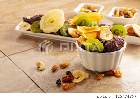 Dried tropical fruits with various nuts and raisins. 125474857