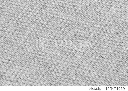 Texture of white natural fabric with large diagonal weaving. Upholstery, cloth background 125475039