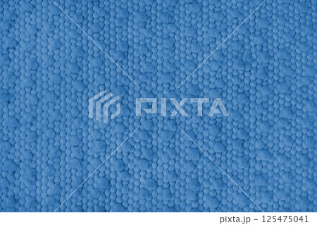 Texture of blue carpet fabric with large coarse textured weaving. Upholstery, cloth background 125475041