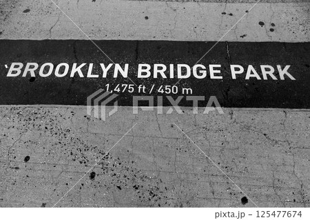 Brooklyn bridge Park signl painted on floor in NY 125477674