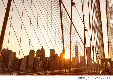 Brooklyn Bridge sunset with Manhattan skyline US Brooklyn Bridge sunset with Manhattan skyline US 125477711