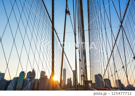 Brooklyn Bridge sunset with Manhattan skyline US 125477712