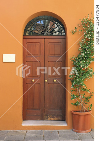 Orange facade retro door 125477904