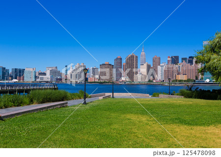 Manhattan New York sunny skyline East River NYC Manhattan New York sunny skyline East River NYC 125478098
