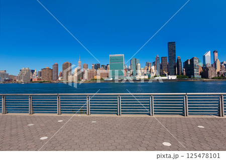 Manhattan New York sunny skyline East River NYC 125478101