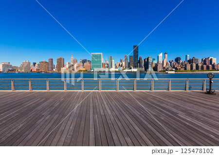 Manhattan New York sunny skyline East River NYC Manhattan New York sunny skyline East River NYC 125478102