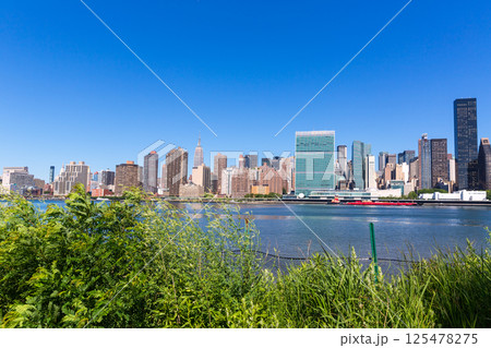 Manhattan New York sunny skyline East River NYC Manhattan New York sunny skyline East River NYC 125478275