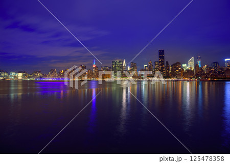 Manhattan New York sunset skyline from East 125478358