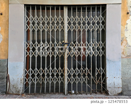 Closed door with locked gate Closed door with locked gate 125478553