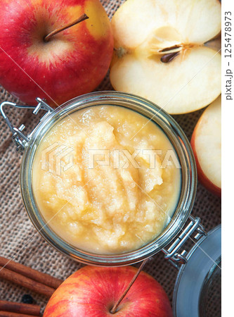 Fresh homemade applesauce with apples. Top view Fresh homemade applesauce with apples. Top view 125478973