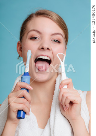 Girl with brush and tongue cleaner. Girl with brush and tongue cleaner. 125480176