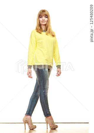blonde fashionable woman in yellow blouse blonde fashionable woman in yellow blouse 125480209