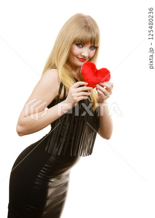 Woman gorgeous girl holding red heart love symbol 125480236