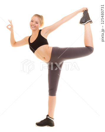 Fitness sporty girl showing ok okay hand sign gesture Fitness sporty girl showing ok okay hand sign gesture 125480731