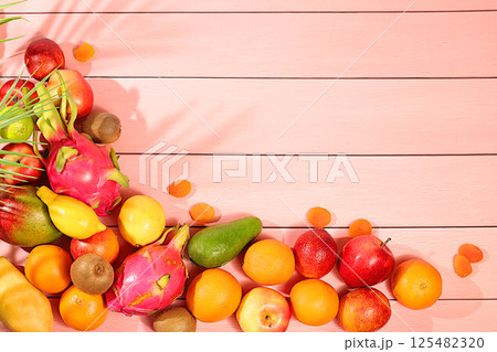 Dragon fruit, pitaya, mango, kiwi, avacado, apples, citrus fruits and dried apricots on a sunny table. Healthy vegan food for weight loss. Banner with tropical exotic fruits and juice. Dragon fruit, pitaya, mango, kiwi, avacado, apples, citrus fruits and dried apricots on a sunny table. Healthy vegan food for weight loss. Banner with tropical exotic fruits and juice. 125482320