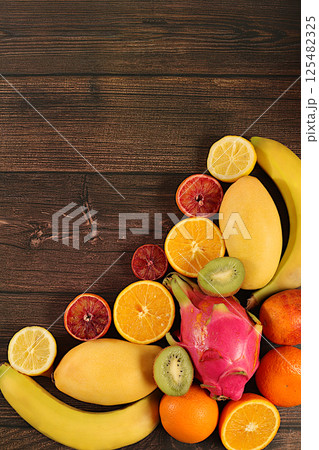 Flyer with tropical exotic fruits, summer vacation and healthy lifestyle concept. Advertising card for a market or store with space for text. Healthy vegan food for weight loss. Flyer with tropical exotic fruits, summer vacation and healthy lifestyle concept. Advertising card for a market or store with space for text. Healthy vegan food for weight loss. 125482325