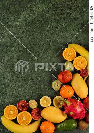 Flyer with tropical exotic fruits, summer vacation and healthy lifestyle concept. Advertising card for a market or store with space for text. Healthy vegan food for weight loss. Flyer with tropical exotic fruits, summer vacation and healthy lifestyle concept. Advertising card for a market or store with space for text. Healthy vegan food for weight loss. 125482326