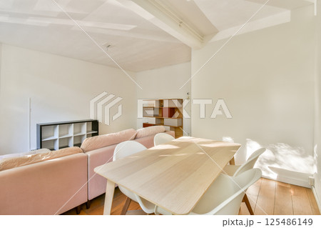 A stylish modern interior showcasing minimalist design elements with a soft color palette and clean lines, emphasizing simplicity and functionality. 125486149