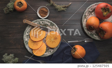 Orange persimmons Orange persimmons 125487505