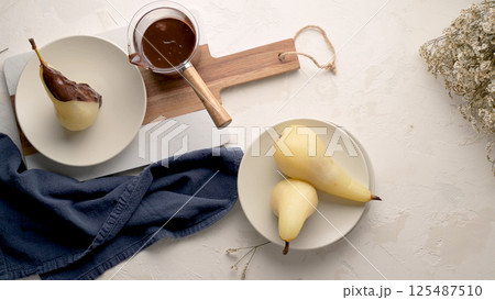 Poached conference pears 125487510