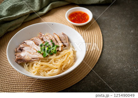 dried duck noodles in white bowl 125490049