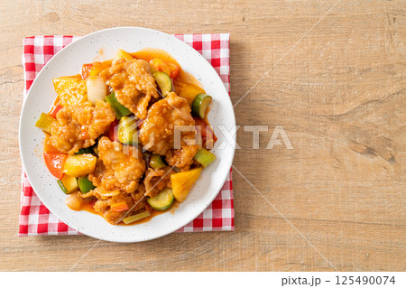 Stir fried sweet and sour sauce with pork Stir fried sweet and sour sauce with pork 125490074