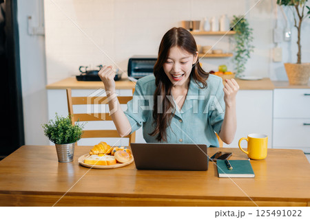 Successful, happy woman working online from home, lifestyle and small business. 125491022